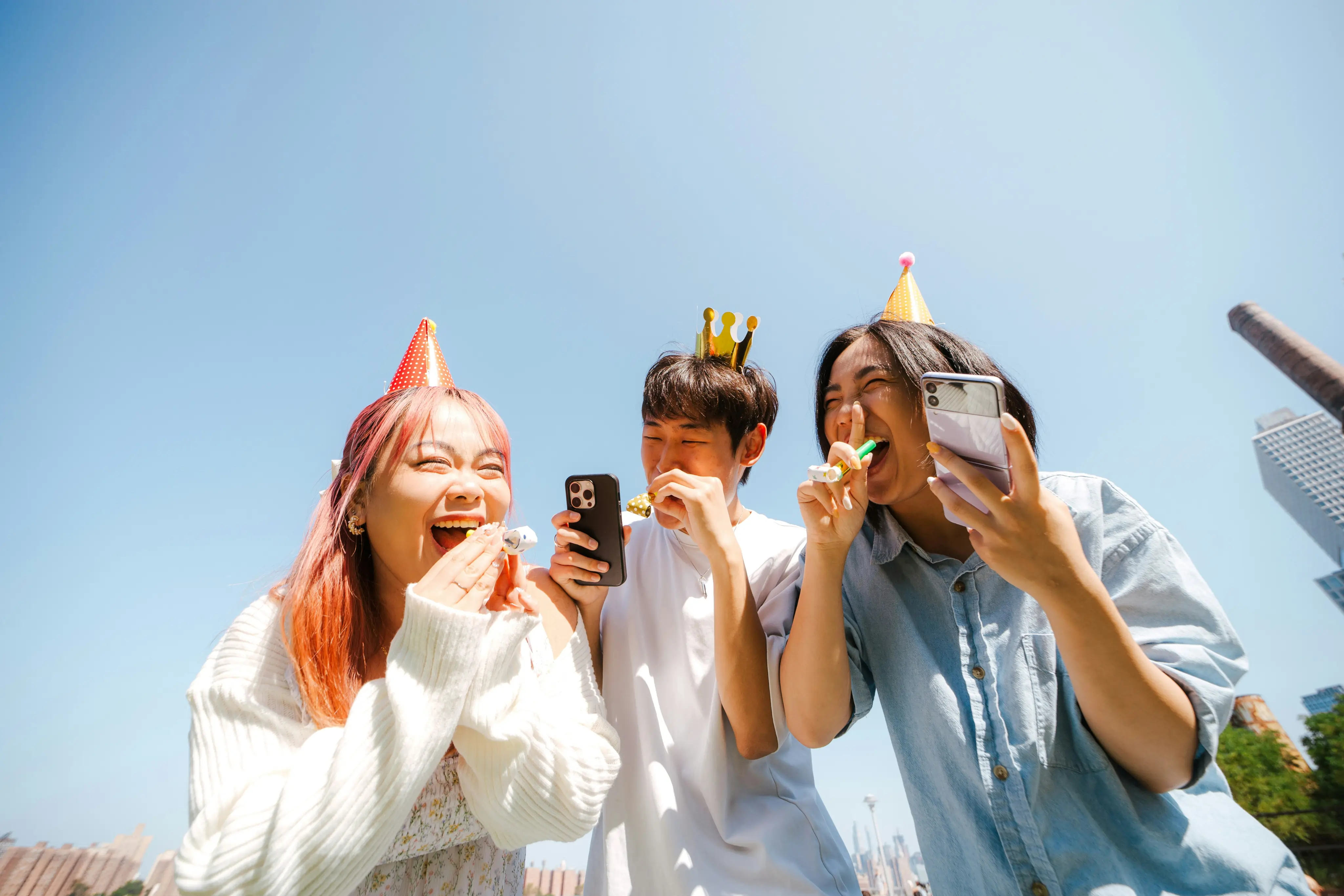 Friends celebrating and scrolling